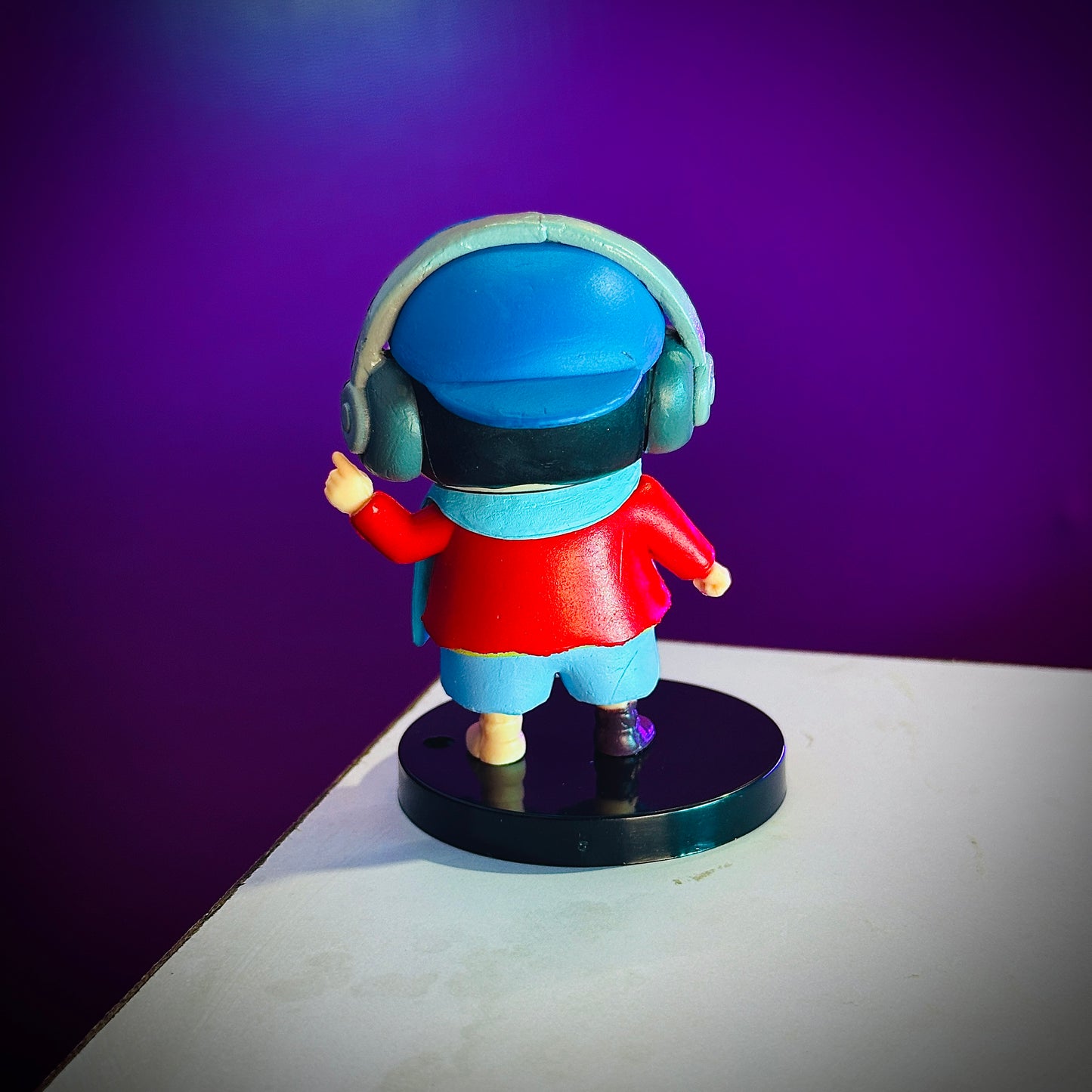 Cool Shinchan anime toy with blue jacket and music pose