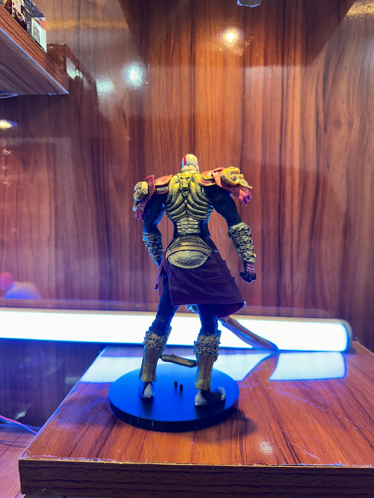 Premium Kratos action figure with sword, muscular warrior design and display base