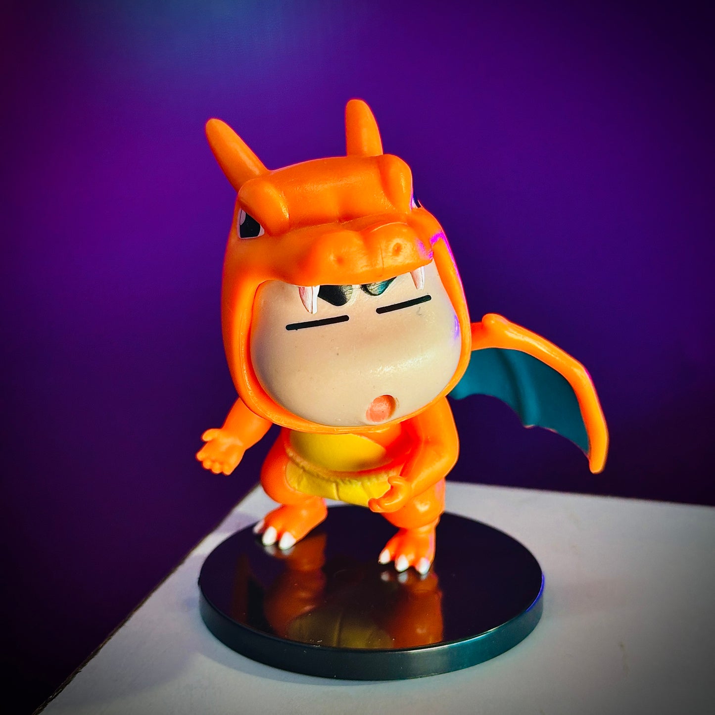 Cute Shinchan in orange dragon outfit collectible figure on display stand