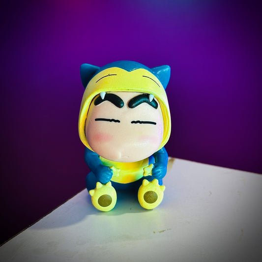 Cute Shinchan anime figure in blue and yellow Snorlax outfit