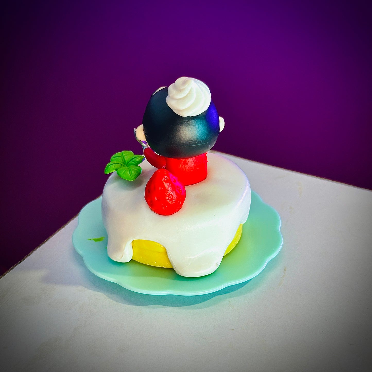  Shinchan anime collectible with dessert and cream topping