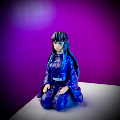 Anime character figurine with blue hair and outfit on a purple background