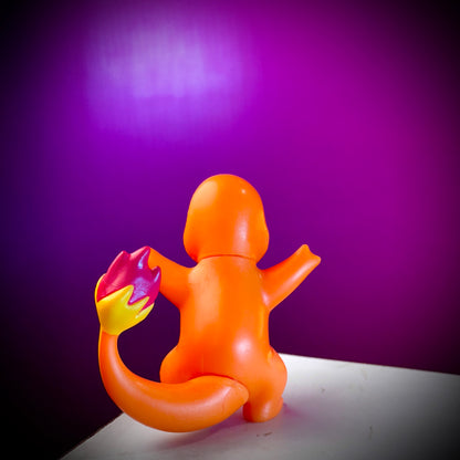 Orange inflatable ring with colorful flame design on a purple background