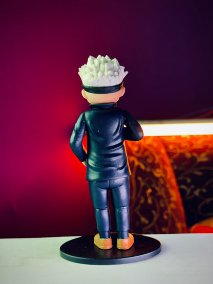 Chibi style Gojo Satoru figure wearing blindfold standing on display base
