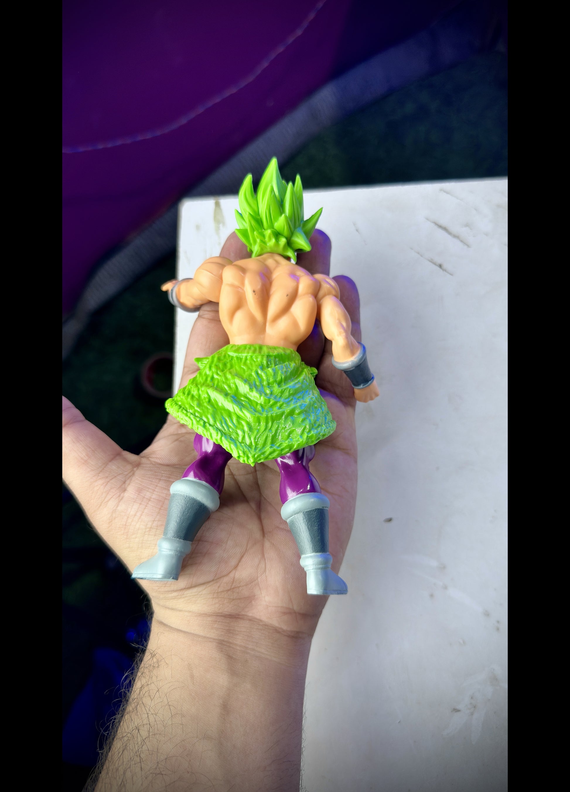 Anime figure of Broly in green Super Saiyan form standing in battle pose from Dragon Ball Super
