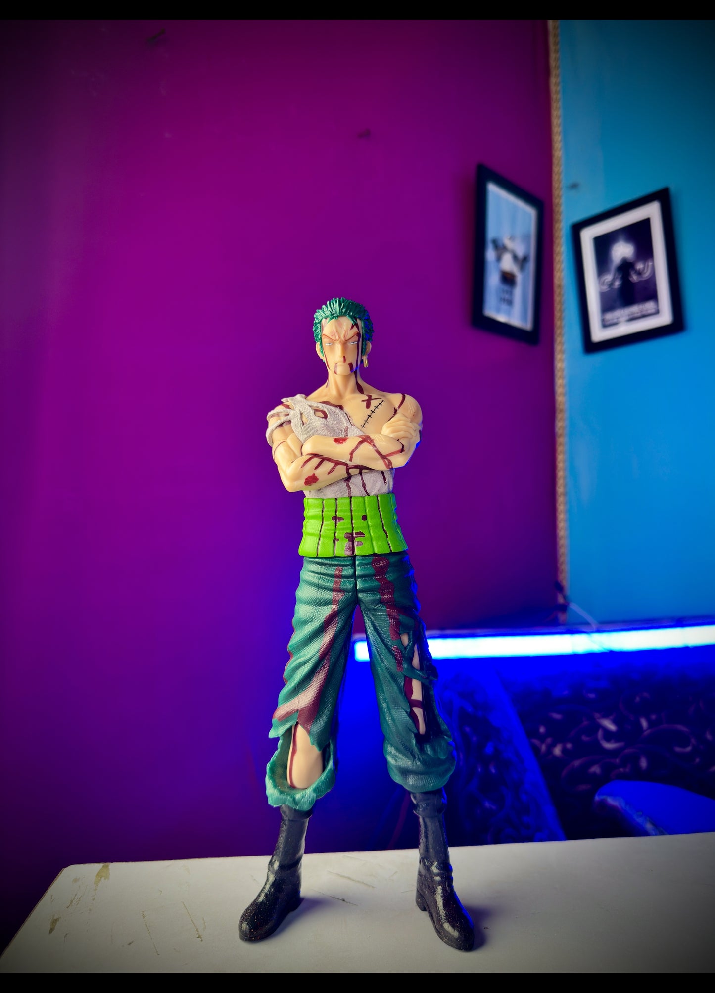 Detailed Zoro anime statue with battle scars from One Piece
