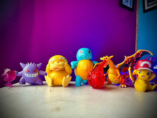 Gengar Psyduck and Pikachu display figures