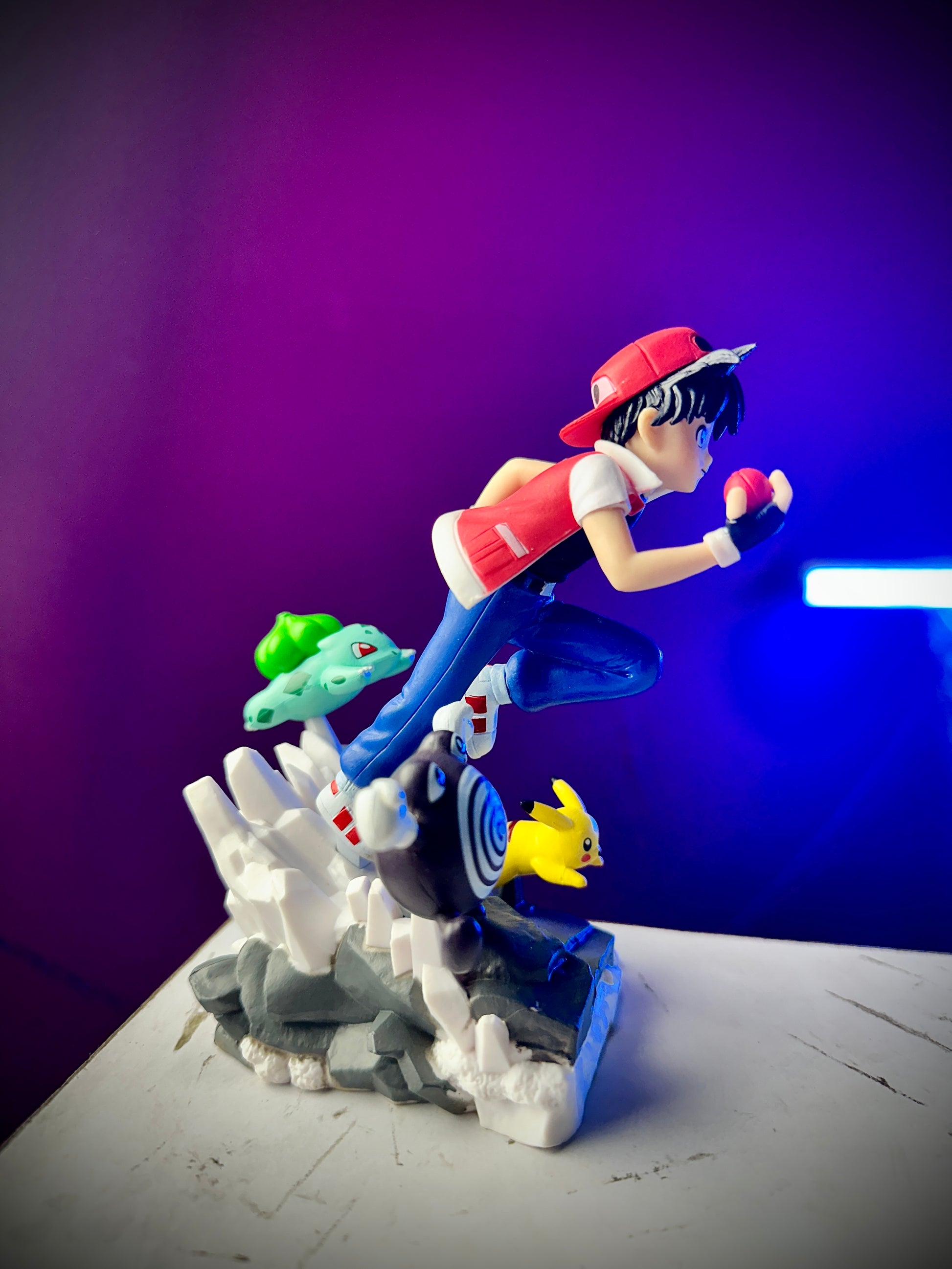 Ash Ketchum anime statue featuring Pikachu and Pokemon friends
