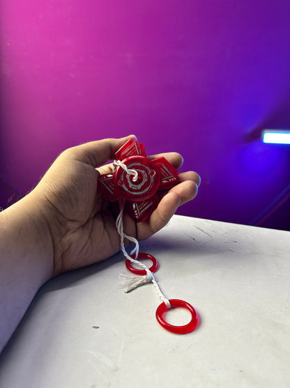 Red sparkling pull string spinner toy