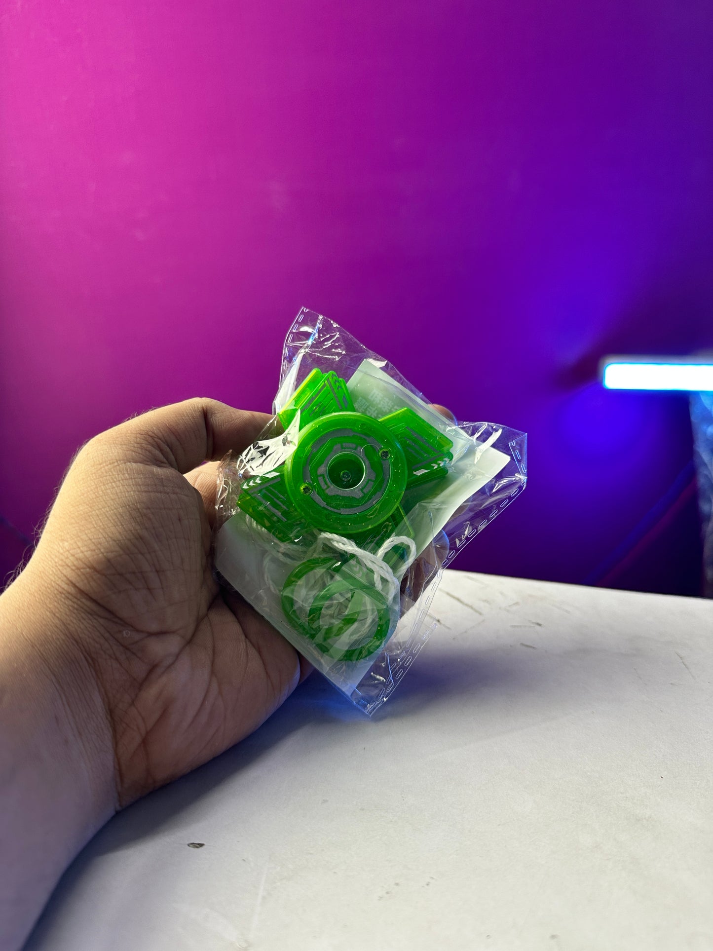 Handheld spinning toy with pull cord launcher