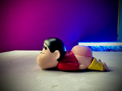 Crayon Shinchan sleeping pose anime figure with funny collectible design.
