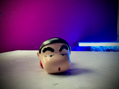 Shinchan PVC collectible statue featuring iconic sleeping pose.