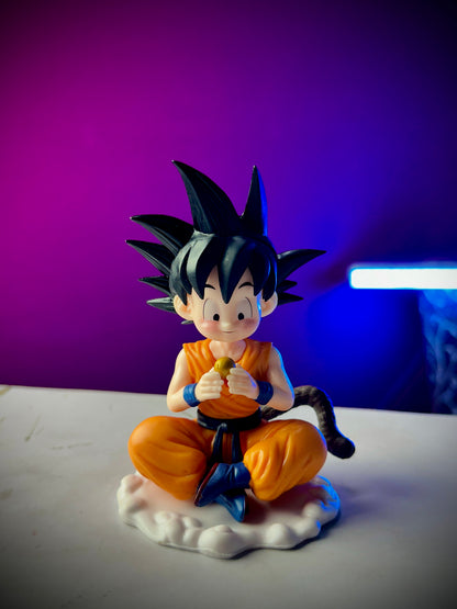 Kid Goku sitting with Dragon Ball collectible figure 13cm
