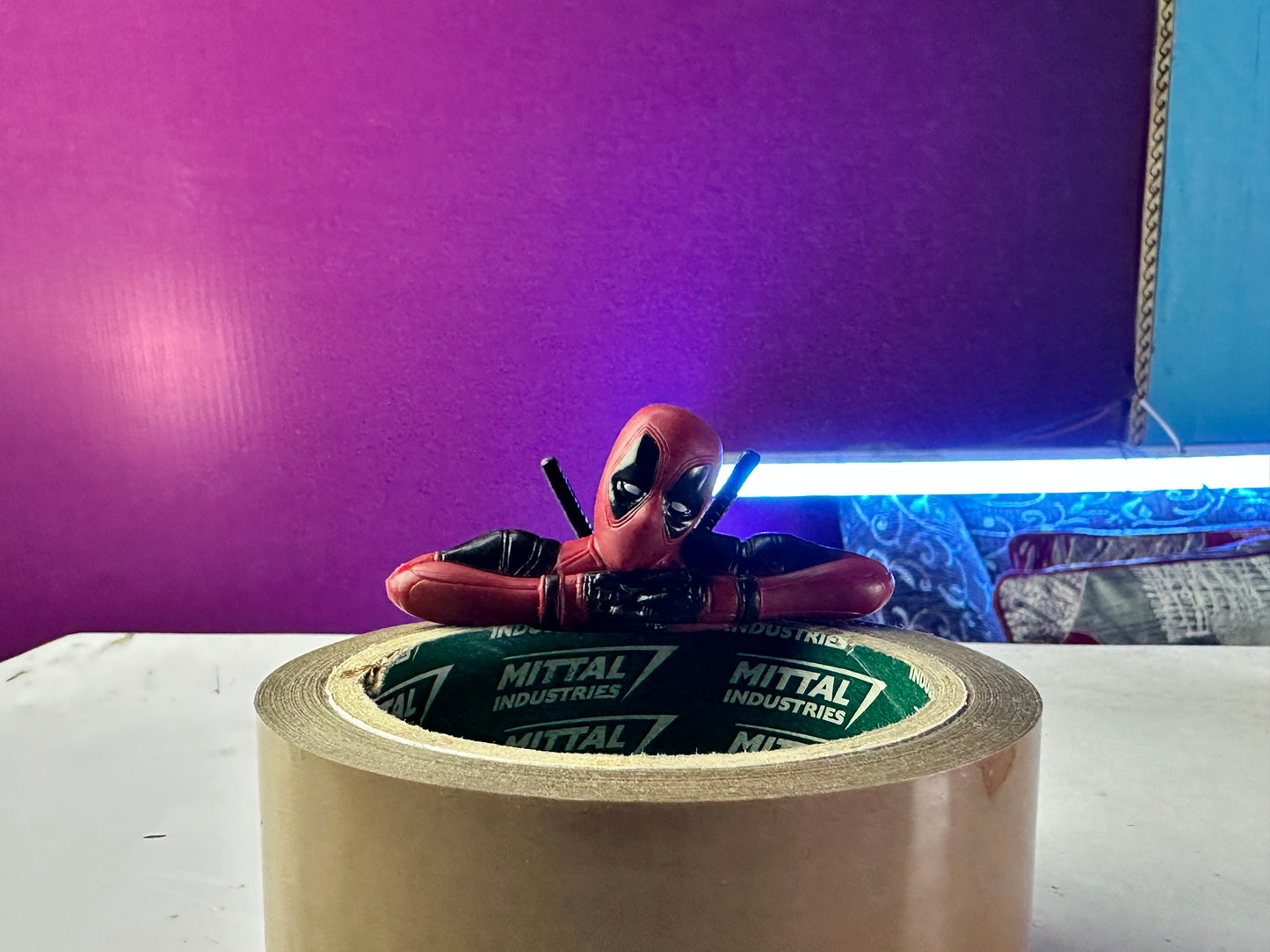 Detailed Deadpool PVC collectible figures with comic styling
