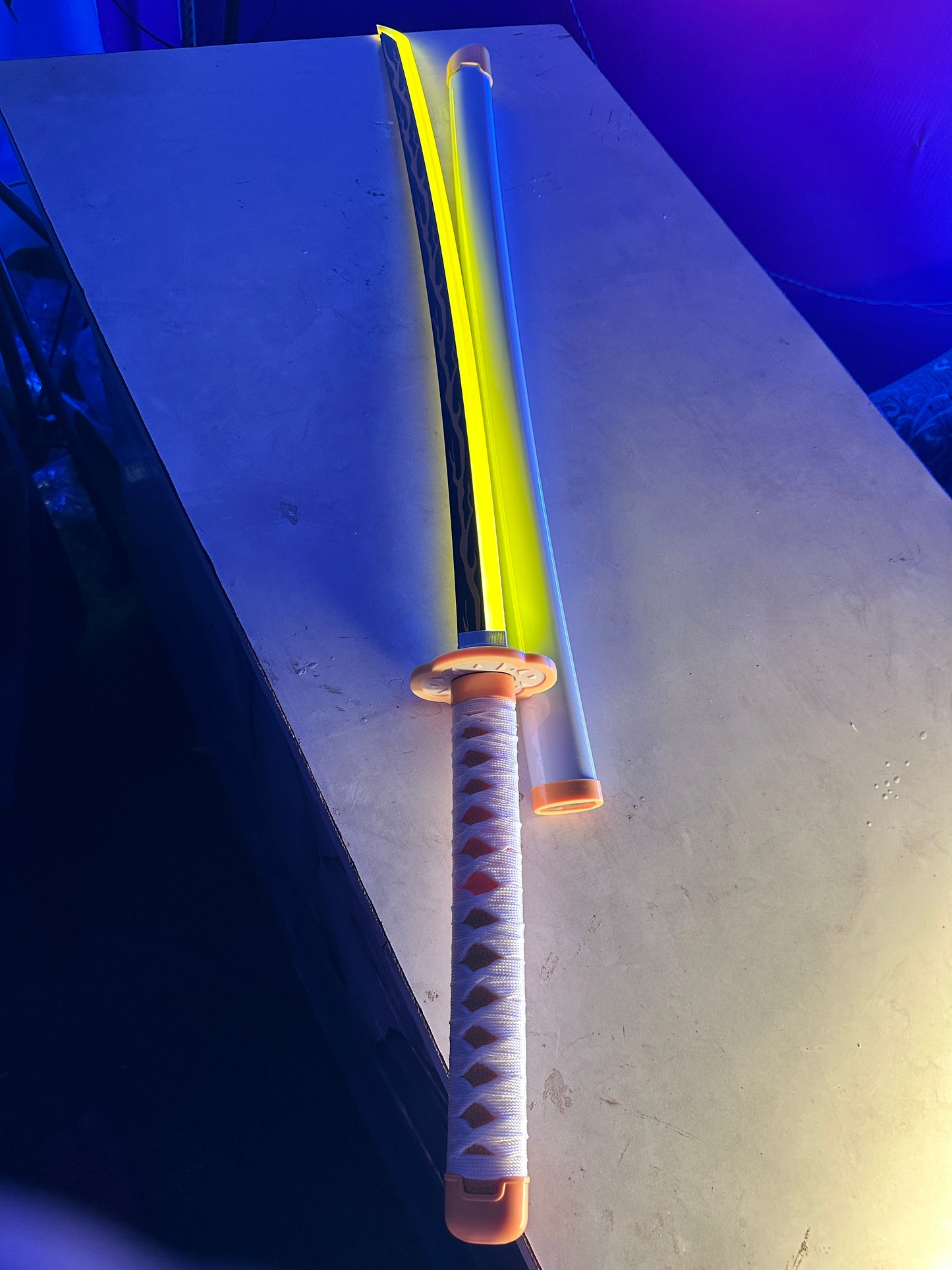 Demon Slayer Zenitsu cosplay sword with LED lighting, detailed grip, and display-ready construction