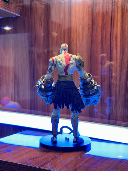 Detailed Kratos gaming figure equipped with Hercules Nemean Cestus gauntlets on a display base.