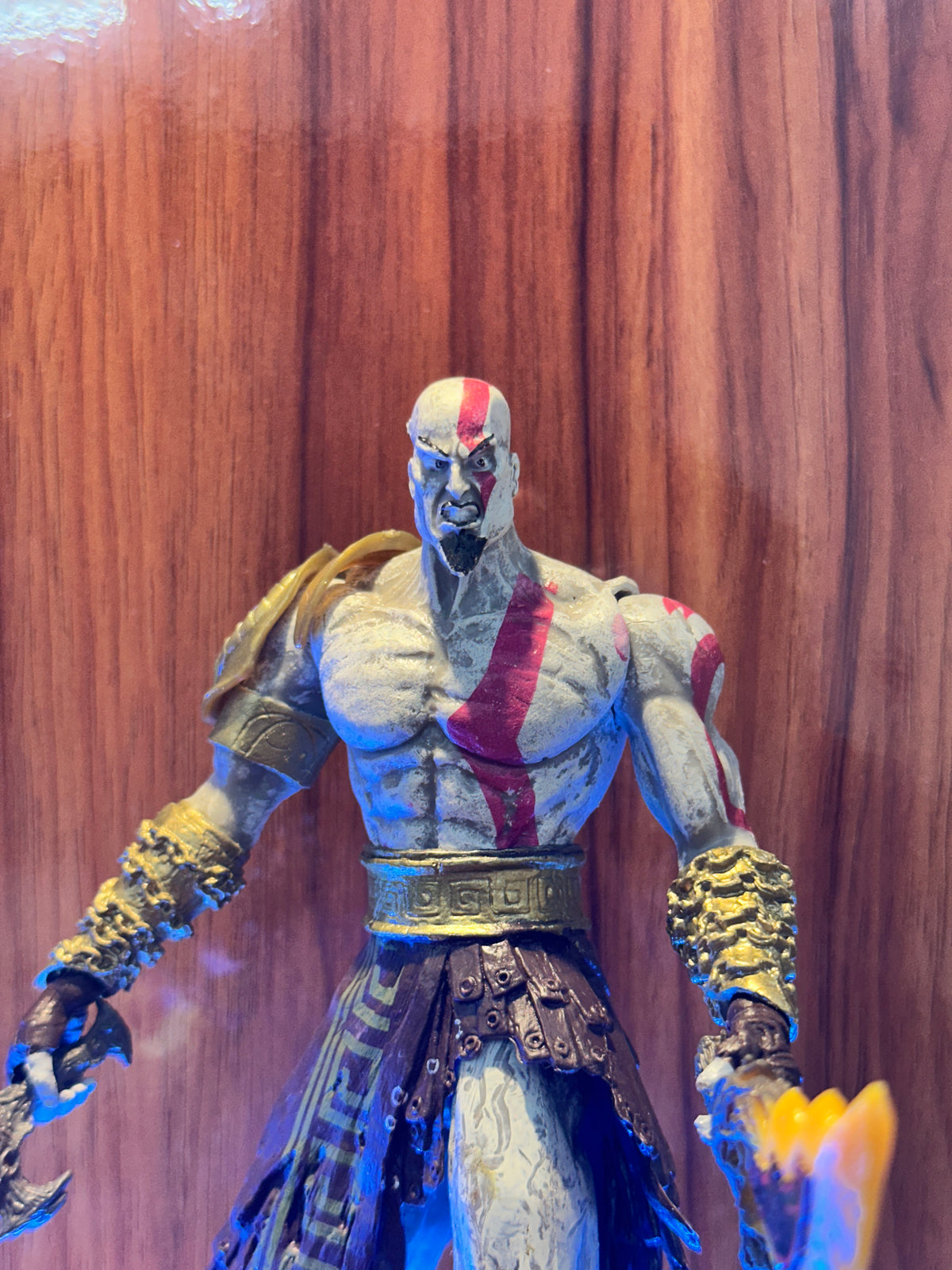 Kratos action figure with blade inspired by God of War, designed for gaming and collectible display