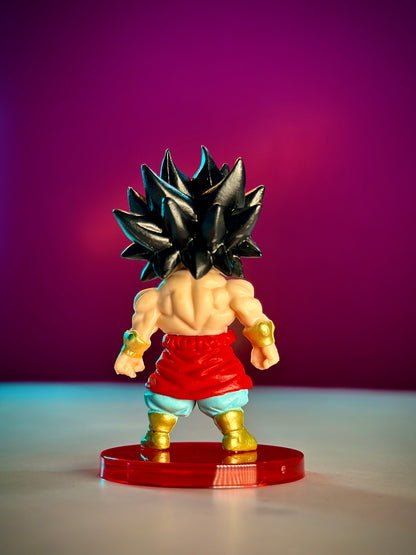 Action figure with spiky hair and red shorts on a purple background