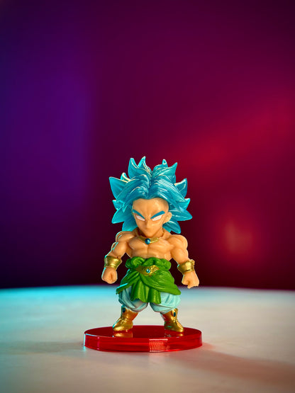 Super Saiyan Blue character figurine on a red base with a gradient purple to red background